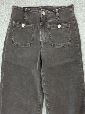 High-Waist Brown Wide Leg Jeans With Gold Button Accents. From France